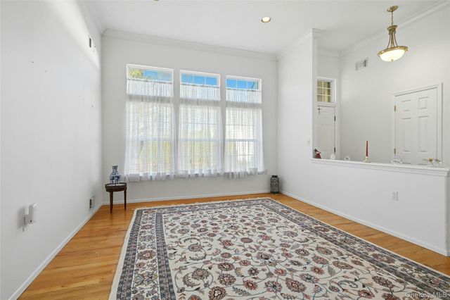 10 Sagaponack Court 10, Ridge, NY 11961