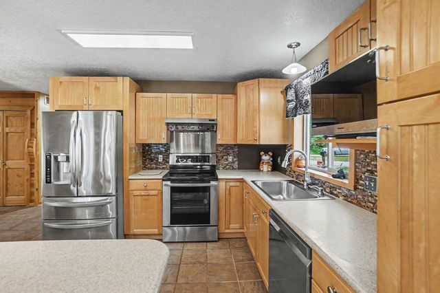 2000 Granada Court, Weidman, MI 48893