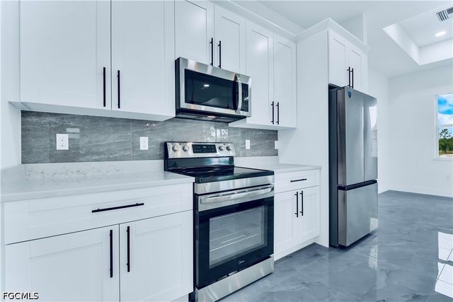 654 Trinity ST E, Lehigh Acres, FL 33974