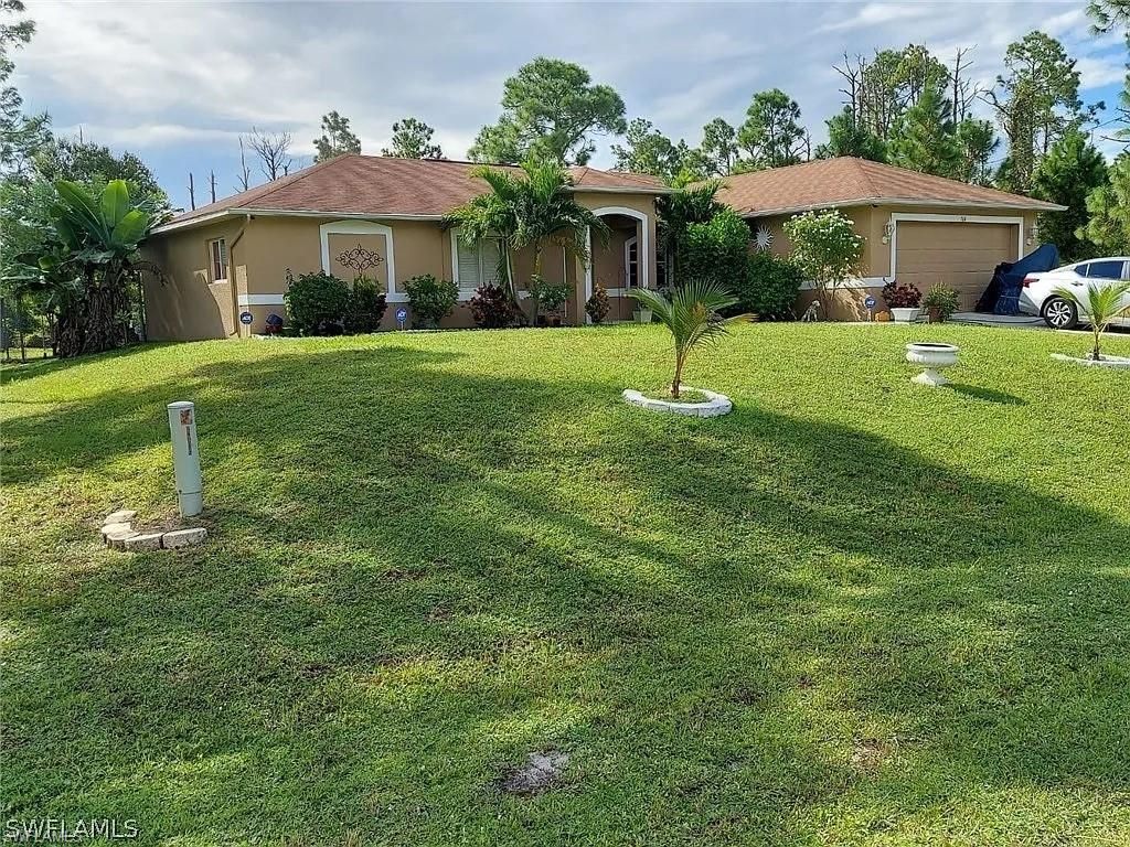 764 Chapman AVE S, LEHIGH ACRES, FL 33974 — exterior