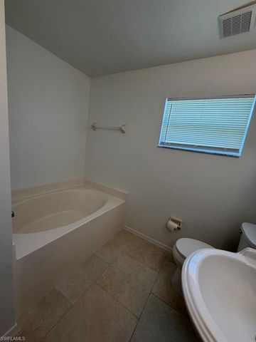 573 Bourse CIR, Lehigh Acres, FL 33974
