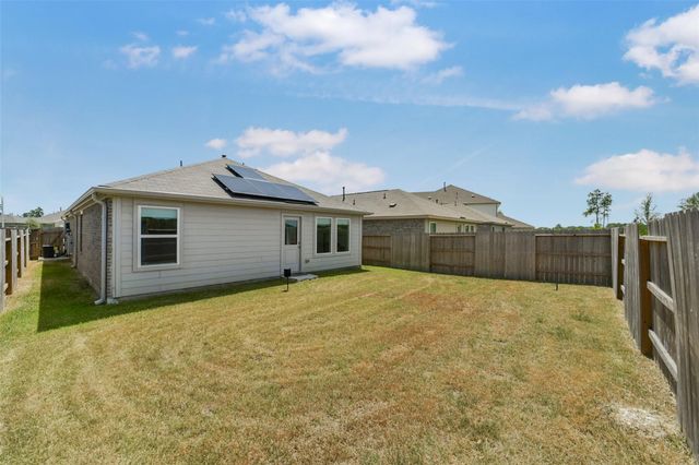 911 Lago Laceno Lane, Huffman, TX 77336