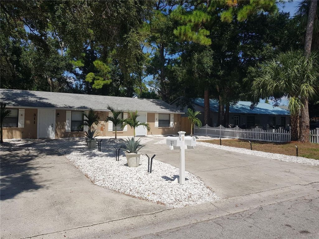 Image 2 of property listing at 311 58TH AVENUE E, Bradenton, FL 34203