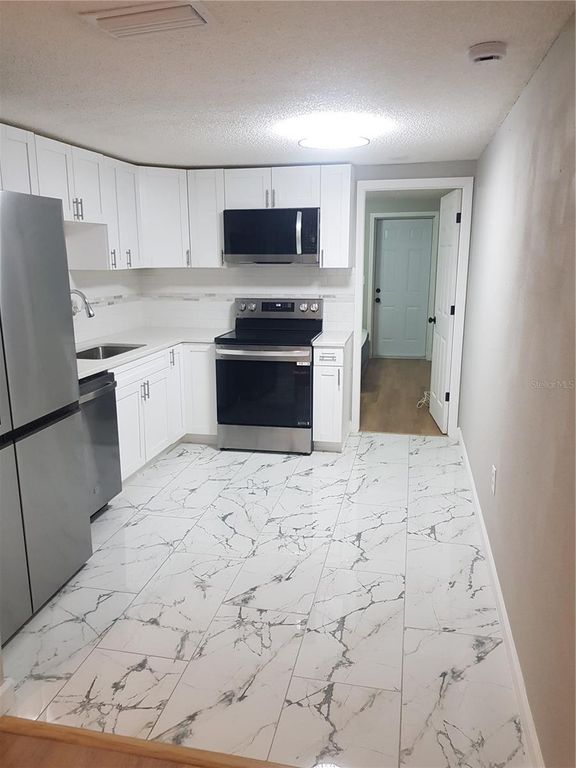 Image 40 of property listing at 311 58TH AVENUE E, Bradenton, FL 34203