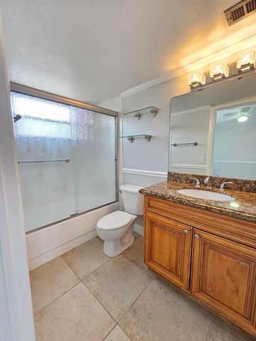 1453 LAKE CRYSTAL Drive D, West Palm Beach, FL 33411