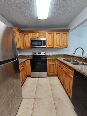 1453 LAKE CRYSTAL Drive D, West Palm Beach, FL 33411