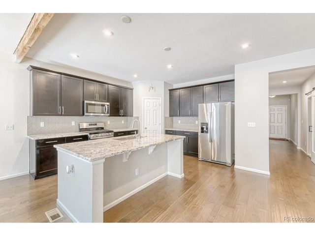 864 Penstemon Dr, Henderson, CO 80640