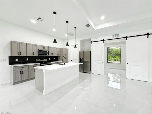 1402 Columbus AVE, Lehigh Acres, FL 33972