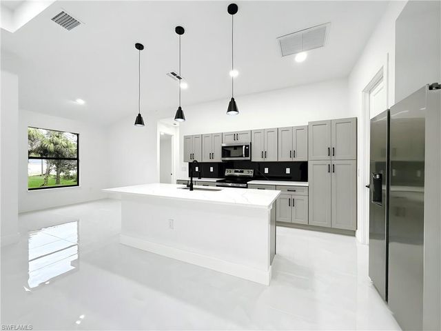 1402 Columbus AVE, Lehigh Acres, FL 33972