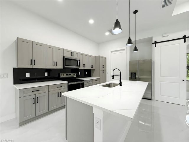 1402 Columbus AVE, Lehigh Acres, FL 33972