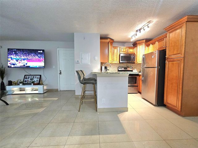 701 Lyons Road 13103, Coconut Creek, FL 33063