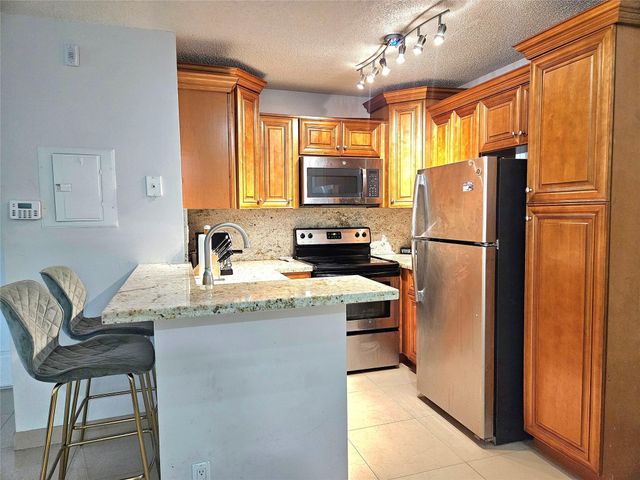 701 Lyons Road 13103, Coconut Creek, FL 33063