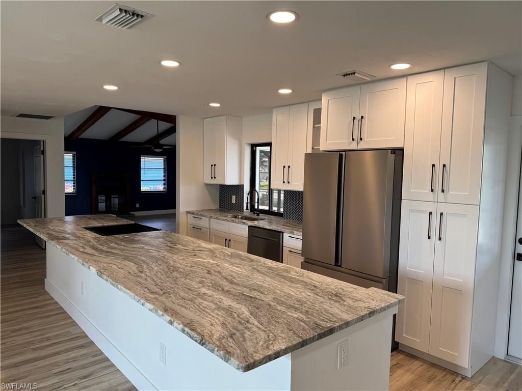 Image 3 of property listing at 115 6th ST, Cape Coral, FL 33990