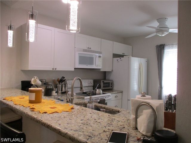 2684 KINGS LAKE BLVD 203, Naples, FL 34112