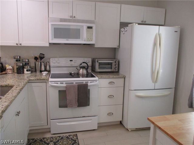 2684 KINGS LAKE BLVD 203, Naples, FL 34112