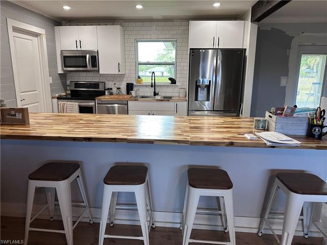 13 E Jasmine RD, Lehigh Acres, FL 33936