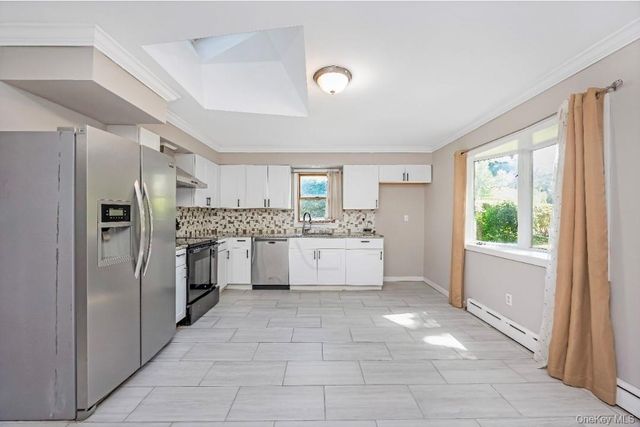9 Half Moon Pond Road, Ridge, NY 11961