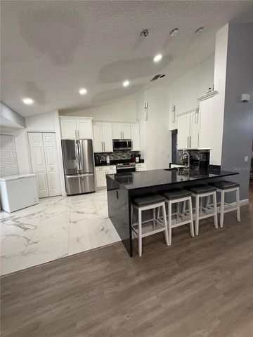 7736 ROLLINGRIDGE COURT, Orlando, FL 32835