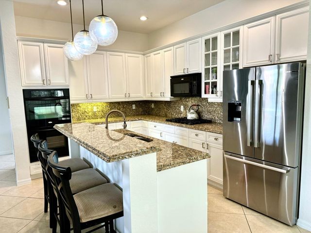 107 Via Escobar Place, Palm Beach Gardens, FL 33418