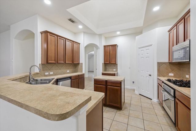 22302 Bridgestone Palm Court, Spring, TX 77388