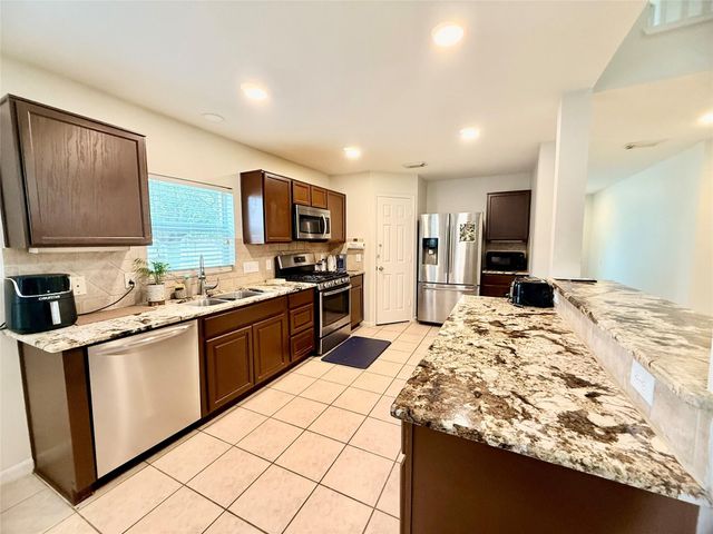 4615 Pin Oak Creek Lane, Houston, TX 77345