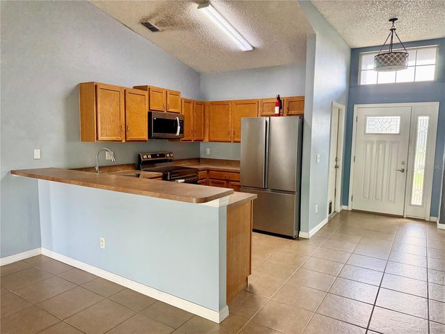 1453 WHOOPING DRIVE, Groveland, FL 34736