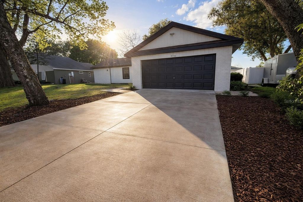 Image 1 of property listing at 12216 FLORIDA WOODS LANE, Orlando, FL 32824