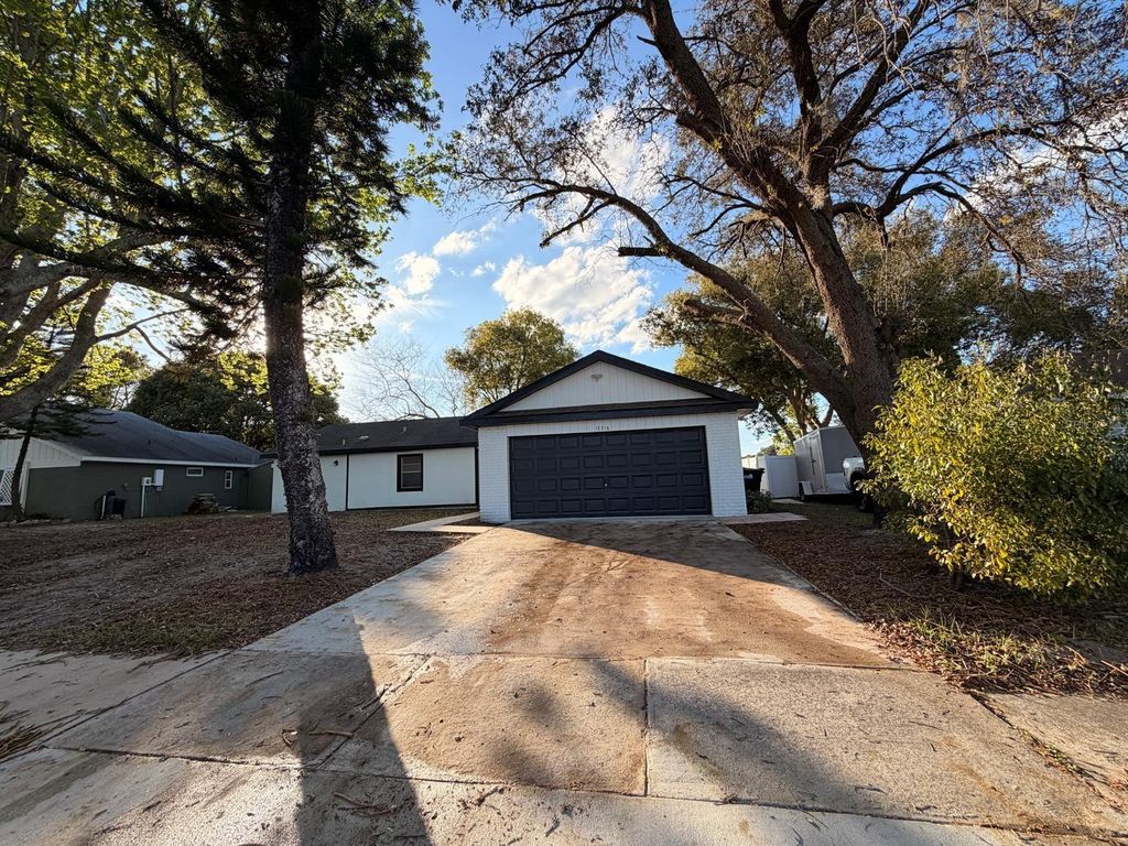Image 2 of property listing at 12216 FLORIDA WOODS LANE, Orlando, FL 32824