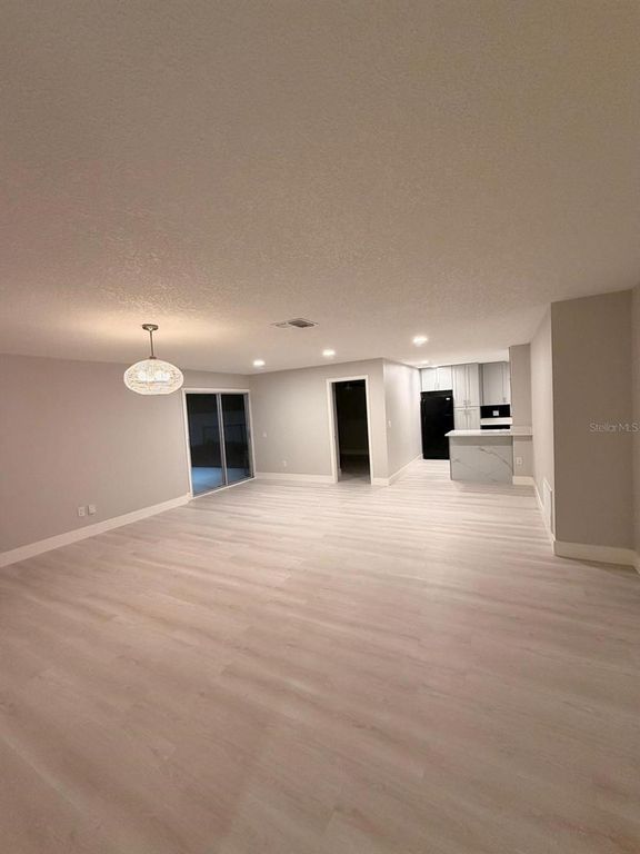 Image 5 of property listing at 12216 FLORIDA WOODS LANE, Orlando, FL 32824