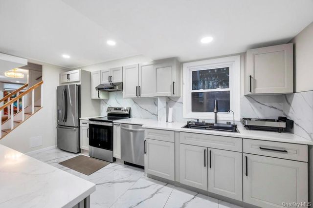 66 Maplewood Drive, Westbury, NY 11590