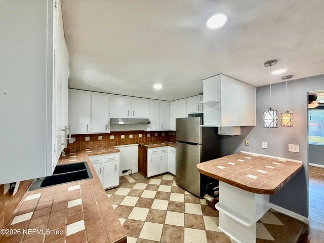 2421 ST LEGER Drive, Jacksonville, FL 32208