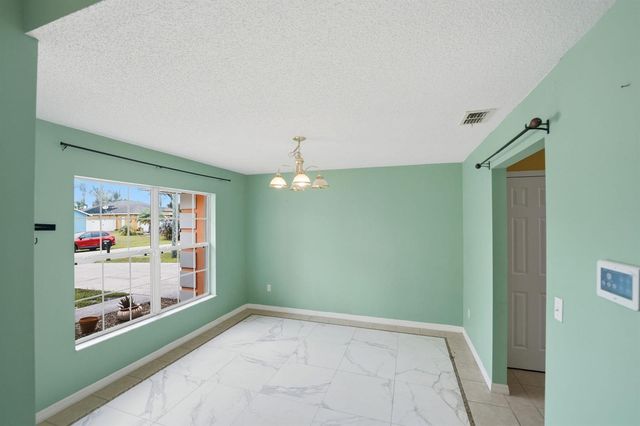 1692 SW Lofgren Avenue, Port St. Lucie, FL 34953