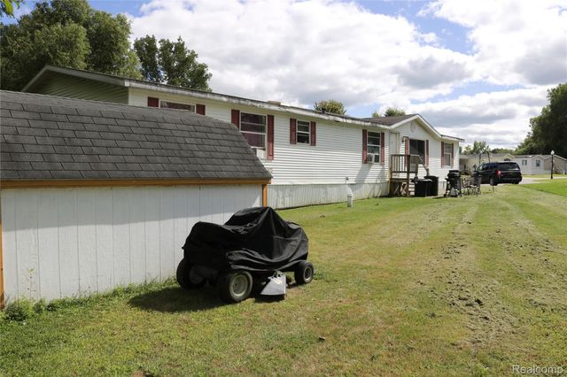 311 Peach Blossom Ct, Otisville Village, MI 48463