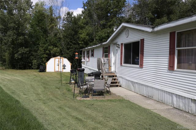 311 Peach Blossom Ct, Otisville Village, MI 48463