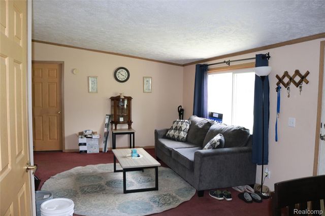 311 Peach Blossom Ct, Otisville Village, MI 48463