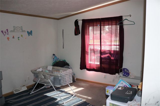 311 Peach Blossom Ct, Otisville Village, MI 48463