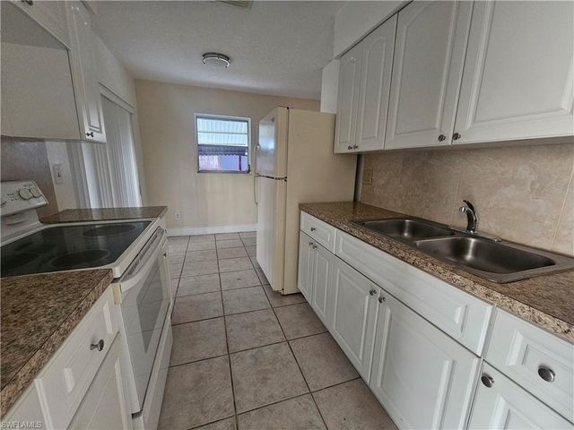 423 Morgan CIR S, Lehigh Acres, FL 33936