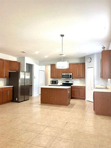 5588 SYCAMORE CANYON DRIVE, Kissimmee, FL 34758