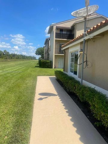 1089 N Benoist Farms Rd 107, West Palm Beach, FL 33411