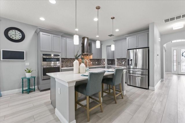 1675 FEATHER GRASS LOOP, Lutz, FL 33558