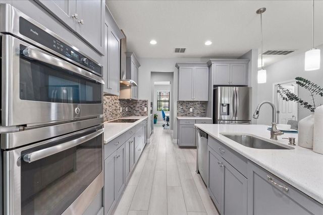 1675 FEATHER GRASS LOOP, Lutz, FL 33558