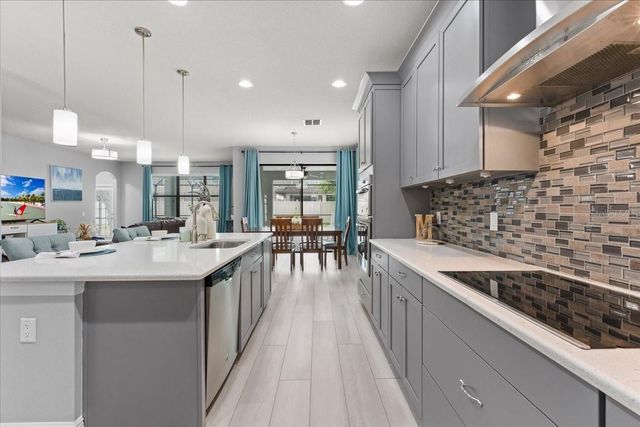 1675 FEATHER GRASS LOOP, Lutz, FL 33558