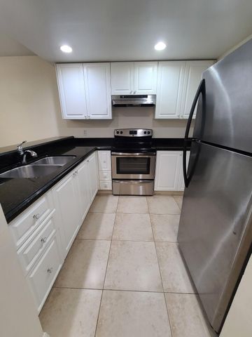 1547 LAKE CRYSTAL Drive A, West Palm Beach, FL 33411
