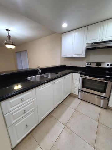 1547 LAKE CRYSTAL Drive A, West Palm Beach, FL 33411