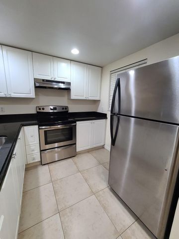 1547 LAKE CRYSTAL Drive A, West Palm Beach, FL 33411