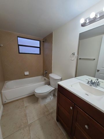 1547 LAKE CRYSTAL Drive A, West Palm Beach, FL 33411