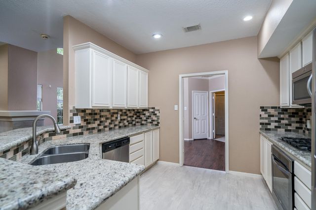 66 Lakeridge Court, The Woodlands, TX 77381