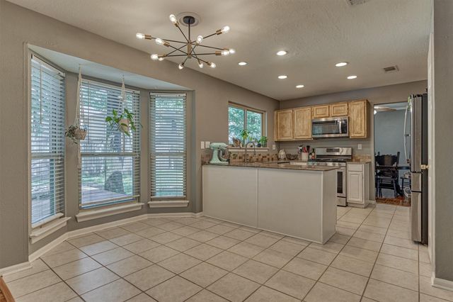 100 W Rainbow Ridge Circle, The Woodlands, TX 77381