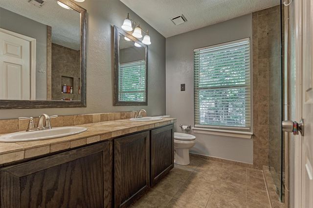 100 W Rainbow Ridge Circle, The Woodlands, TX 77381