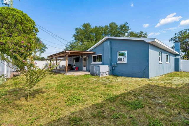 10748 VILLAGE GREEN AVE, Seminole, FL 33772